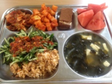 Napa and radish kimchi, chocolate cake, allll the watermelon, seaweed and tofu soup, rice fried up with veggies and I think canned fish, and a salad of cucumber, perilla leaves, and possibly mint topped with sweet/sour chili-vinegar sauce.